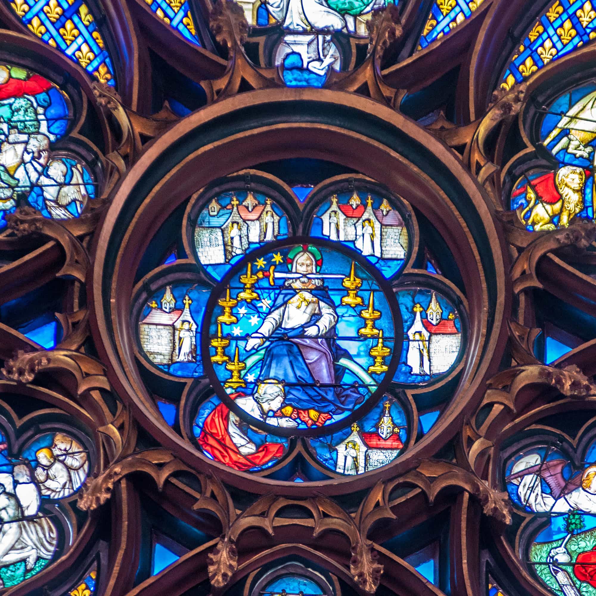 A closeup of the rose window at Notre Dame Cathedral in Paris, France